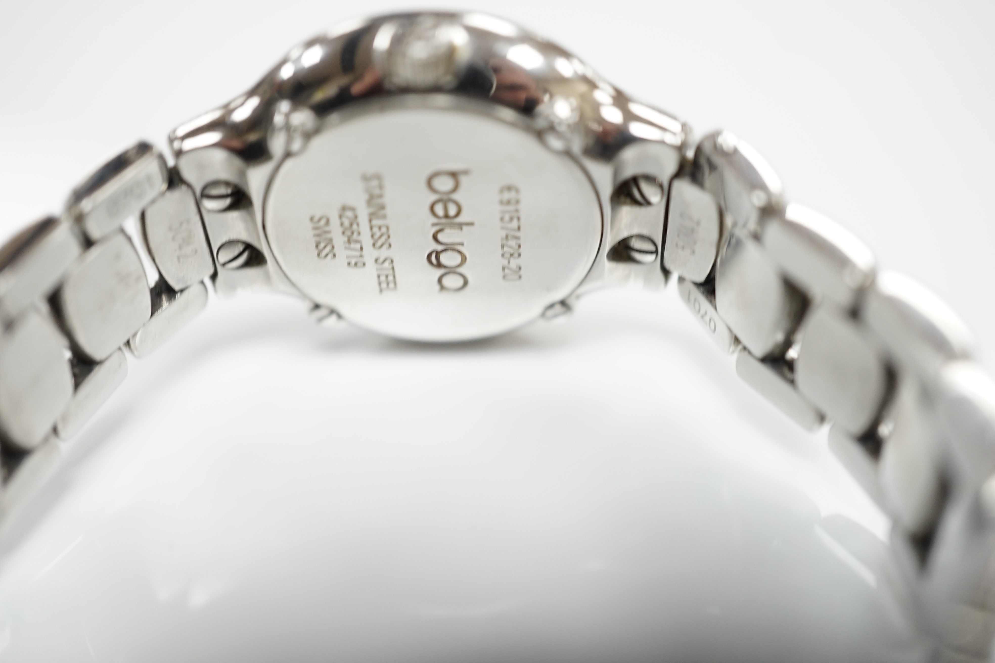 A lady's 2001 stainless steel Ebel quartz wrist watch, with diamond set bezel, mother of pearl dial and diamond dot markers, on a stainless steel bracelet, with box and guarantee.